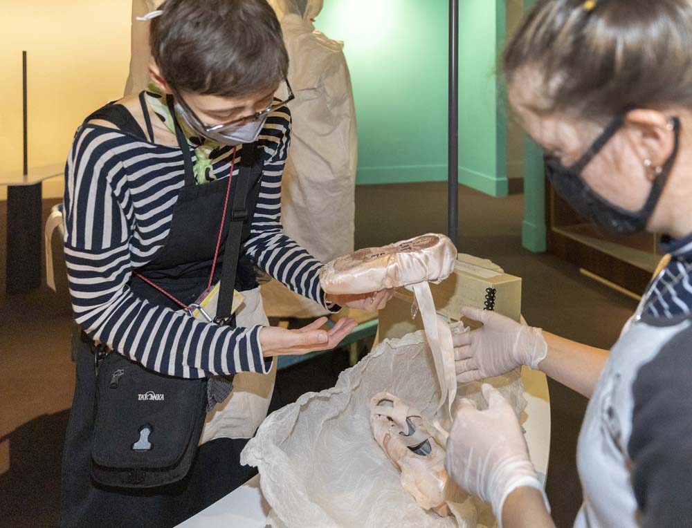 Conservators checking Darcey Bussells shoes before installing them