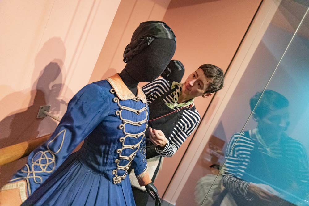 Conservator, Gesa, installing Tamara Karsavina’s costume for Les Cantinières 1926