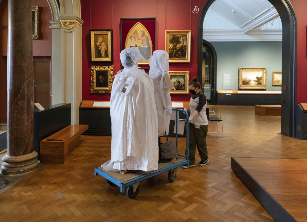 Wrapped costumes ferried through the paintings gallery from the conservation studio to the Theatre & Performance gallery to be installed