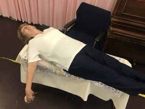 Rhona McNab lying down at the end of exams with bell