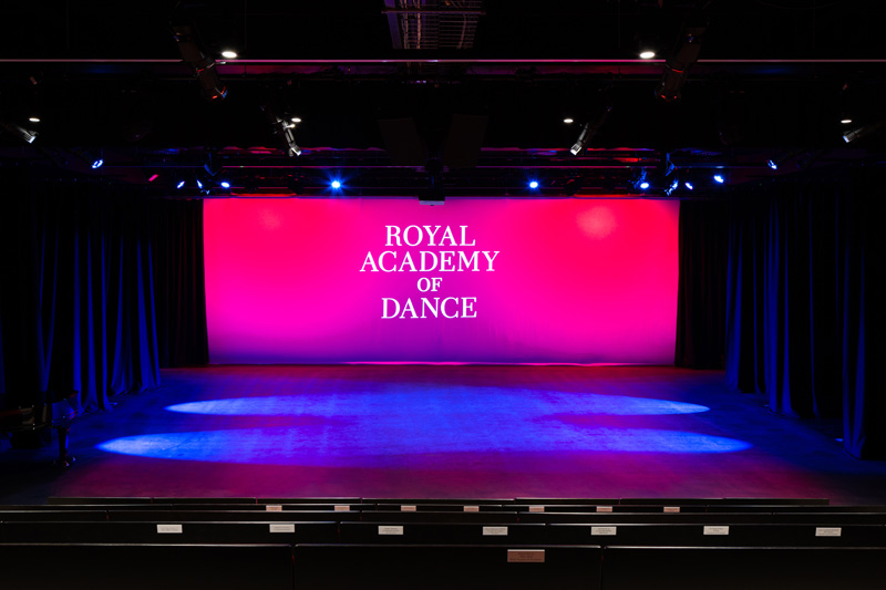 The stage at the Aud Jebsen Studio Theatre with a projection of the RAD logo on the screen.